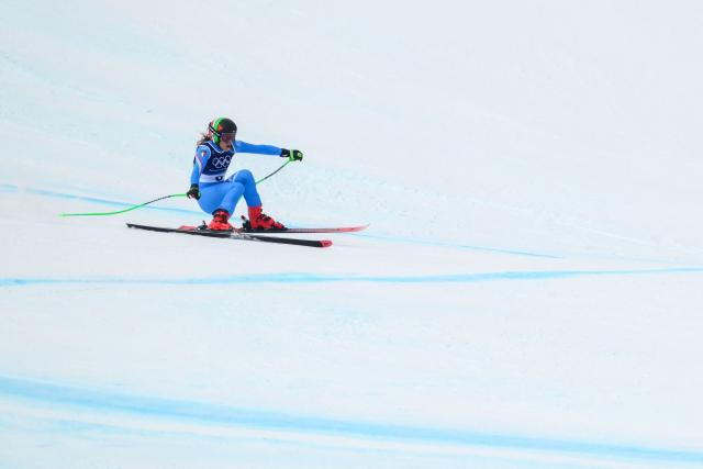 Italy's Sofia Goggia reacts after crashing in the downhill run of the women's team combined event during the Milano Cortina 2026 Winter Olympic Games at the Tofane Alpine Skiing Centre in Cortina d’Ampezzo on February 10, 2026. (Photo by Marco BERTORELLO / AFP)