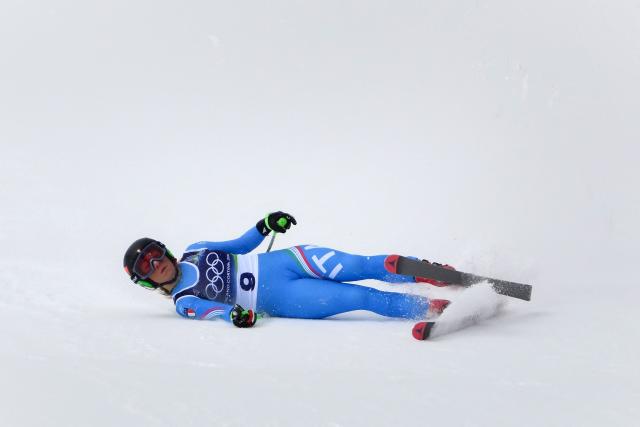 Italy's Sofia Goggia crashes as she competes in the downhill run of the women's team combined event during the Milano Cortina 2026 Winter Olympic Games at the Tofane Alpine Skiing Centre in Cortina d’Ampezzo on February 10, 2026. (Photo by Marco BERTORELLO / AFP)