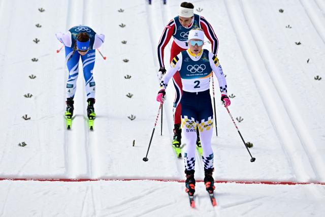 Sweden's Jonna Sundling crosses the finish after competing in heat 1 of the women's cross country sprint classic quarterfinals event of the Milano Cortina 2026 Winter Olympic Games at Tesero Cross-Country Skiing Stadium in Lago di Tesero (Val di Fiemme), on February 10, 2026. (Photo by Tobias SCHWARZ / AFP)