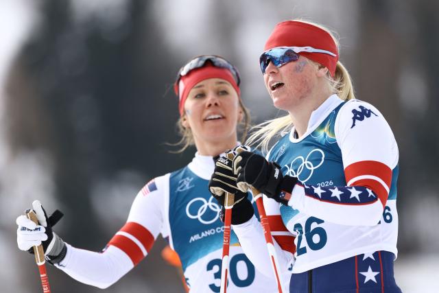 US' Lauren Jortberg and USA's Sammy Smith react after competing in heat 1 of the women's cross country sprint classic quarterfinals event of the Milano Cortina 2026 Winter Olympic Games at Tesero Cross-Country Skiing Stadium in Lago di Tesero (Val di Fiemme), on February 10, 2026. (Photo by Anne-Christine POUJOULAT / AFP)
