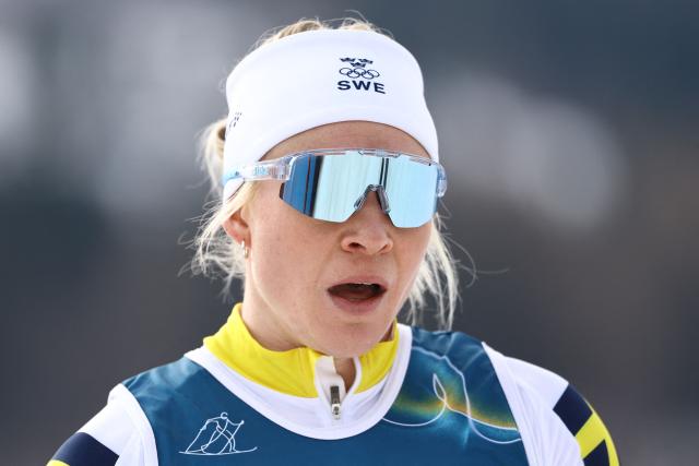 Sweden's Jonna Sundling reacts after competing in heat 1 of the women's cross country sprint classic quarterfinals event of the Milano Cortina 2026 Winter Olympic Games at Tesero Cross-Country Skiing Stadium in Lago di Tesero (Val di Fiemme), on February 10, 2026. (Photo by Anne-Christine POUJOULAT / AFP)