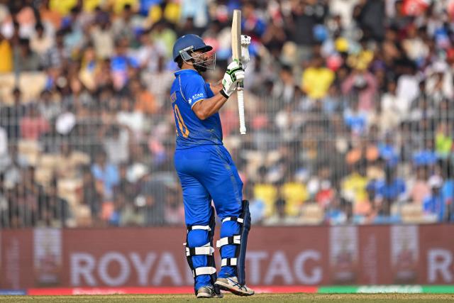 UAE's captain Muhammad Waseem celebrates after scoring a half-century (50 runs) during the 2026 ICC Men's T20 Cricket World Cup group stage match between New Zealand and United Arab Emirates at the MA Chidambaram Stadium in Chennai on February 10, 2026. (Photo by R. Satish BABU / AFP)
