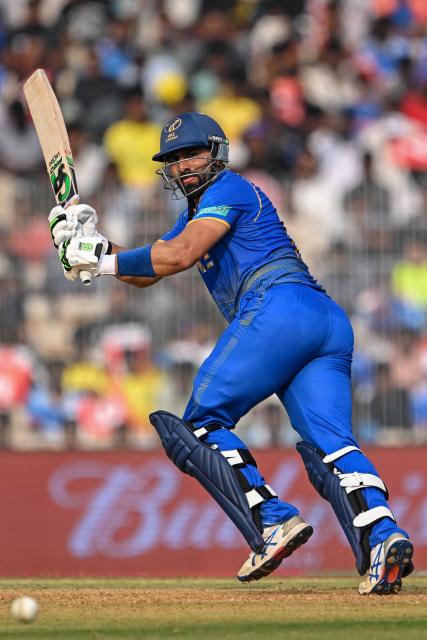 UAE's captain Muhammad Waseem runs after playing a shot during the 2026 ICC Men's T20 Cricket World Cup group stage match between New Zealand and United Arab Emirates at the MA Chidambaram Stadium in Chennai on February 10, 2026. (Photo by R. Satish BABU / AFP)