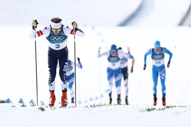 USA's Ben Ogden competes in heat 2 of the men's cross country sprint classic quarterfinal event of the Milano Cortina 2026 Winter Olympic Games at Tesero Cross-Country Skiing Stadium in Lago di Tesero (Val di Fiemme), on February 10, 2026. (Photo by Anne-Christine POUJOULAT / AFP)