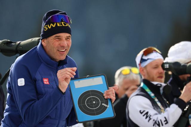 Sweden's head coach Johannes Lukas (L) gestures during warm up ahead of the men's biathlon 20km individual event during the Milano Cortina 2026 Winter Olympic Games at the Anterselva Biathlon Arena (Sudtirol Arena) in Anterselva (Val Pusteria) on February 10, 2026. (Photo by FRANCK FIFE / AFP)