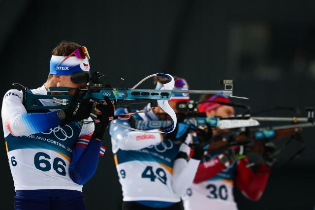 (From L to R) France's Emilien Jacquelin, US' Maxime Germain and Switzerland's Joscha Burkhalter wamrs up in the shooting range ahead of the men's biathlon 20km individual event during the Milano Cortina 2026 Winter Olympic Games at the Anterselva Biathlon Arena (Sudtirol Arena) in Anterselva (Val Pusteria) on February 10, 2026. (Photo by FRANCK FIFE / AFP)