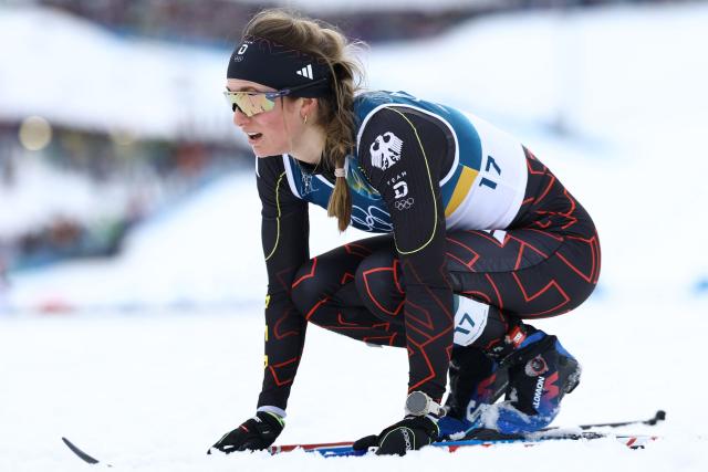 Germany's Laura Gimmler reacts after competing in heat 2 of the women's cross country sprint classic semifinals event of the Milano Cortina 2026 Winter Olympic Games at Tesero Cross-Country Skiing Stadium in Lago di Tesero (Val di Fiemme), on February 10, 2026. (Photo by Anne-Christine POUJOULAT / AFP)
