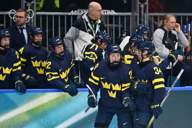 Sweden's #34 Mira Hallin (R) celebrates scoring her team's third goal with Sweden's #29 Felizia Wikner Zienkiewicz and team mates during the women's preliminary round Group B Ice Hockey match between Japan and Sweden at the Milano Rho Ice Hockey Arena at the Milano Cortina 2026 Winter Olympic Games in Milan, on February 10, 2026. (Photo by Piero CRUCIATTI / AFP)