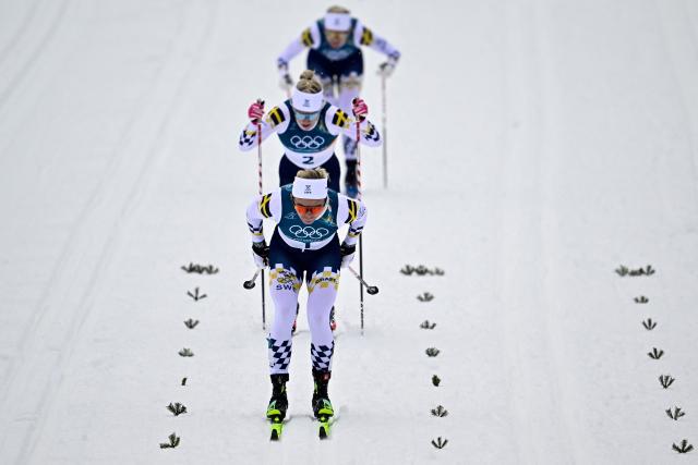 (From Front) Sweden's Linn Svahn, Sweden's Jonna Sundling and Sweden's Maja Dahlqvist compete during the women's cross country sprint classic final event of the Milano Cortina 2026 Winter Olympic Games at Tesero Cross-Country Skiing Stadium in Lago di Tesero (Val di Fiemme), on February 10, 2026. (Photo by Tobias SCHWARZ / AFP)