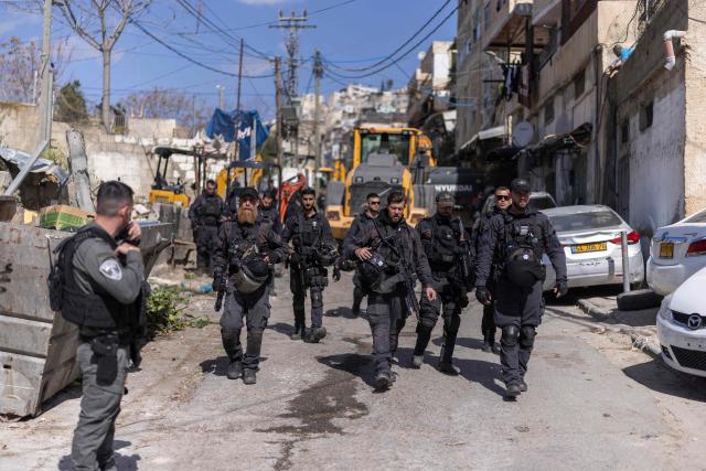 Israeli security forces block the entrance to the al-Bustan area of the Palestinian neighbourhood of Silwan, in Israeli-annexed east Jerusalem, during the demolition of structures on February 10, 2026. (Photo by ilia YEFIMOVICH / AFP)
