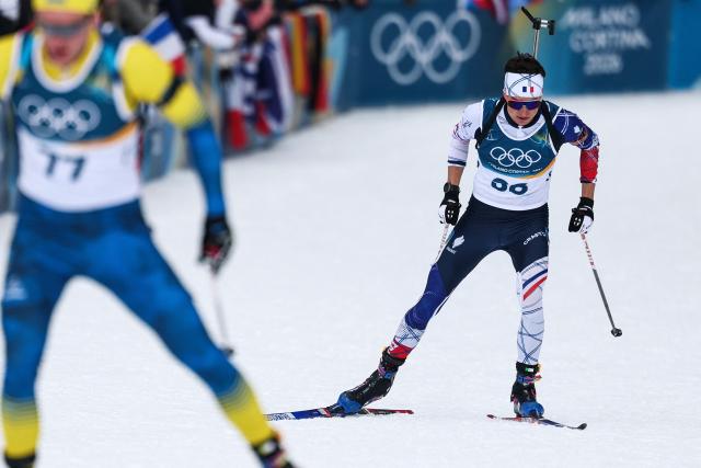 France's Eric Perrot (R) skis during the men's biathlon 20km individual event during the Milano Cortina 2026 Winter Olympic Games at the Anterselva Biathlon Arena (Sudtirol Arena) in Anterselva (Val Pusteria) on February 10, 2026. (Photo by FRANCK FIFE / AFP)