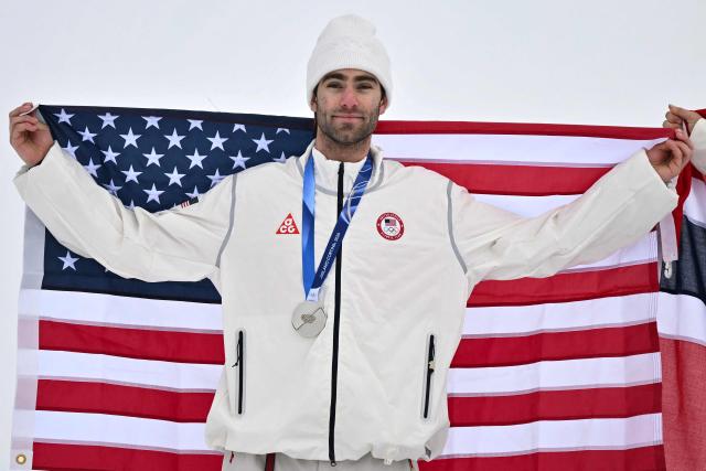 Silver medallist USA's Alex Hall celebrates on the podium after the freestyle skiing men's freeski slopestyle final during the Milano Cortina 2026 Winter Olympic Games at Livigno Snow Park, in Livigno (Valtellina), on February 10, 2026. (Photo by Jeff PACHOUD / AFP)