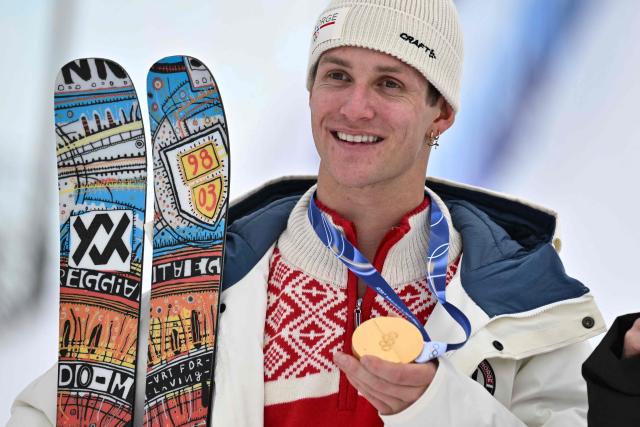 Gold medallist Norway's Birk Ruud celebrates on the podium after the freestyle skiing men's freeski slopestyle final during the Milano Cortina 2026 Winter Olympic Games at Livigno Snow Park, in Livigno (Valtellina), on February 10, 2026. (Photo by Jeff PACHOUD / AFP)