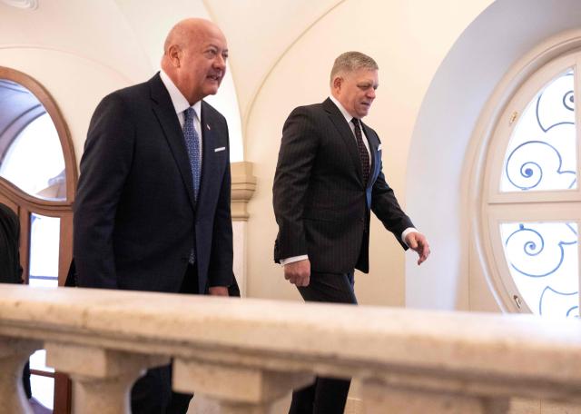 Slovakia's Prime Minister Robert Fico (R) welcomes Austria's Chancellor Christian Stocker prior to the so-called S3 (Slavkov format) meeting with Czech Prime Minister in Bratislava, Slovakia, on February 10, 2026. (Photo by Joe Klamar / AFP)