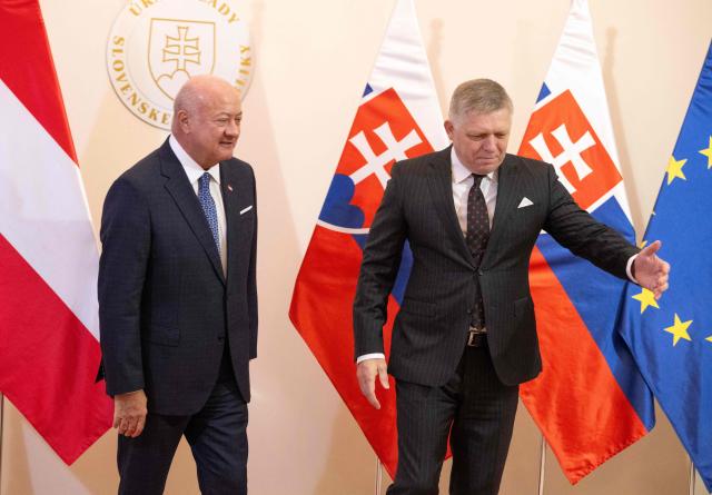 Slovakia's Prime Minister Robert Fico (R) welcomes Austria's Chancellor Christian Stocker prior to the so-called S3 (Slavkov format) meeting with Czech Prime Minister in Bratislava, Slovakia, on February 10, 2026. (Photo by Joe Klamar / AFP)