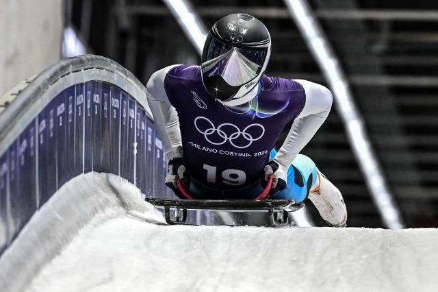 France's Lucas Defayet takes part in the skeleton men's training session at Cortina Sliding Centre during the Milano Cortina 2026 Winter Olympic Games in Cortina d'Ampezzo on February 10, 2026. (Photo by Tiziana FABI / AFP)