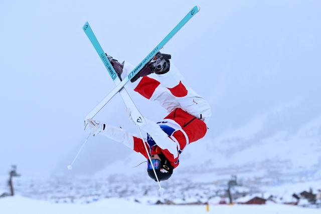 China's Yang Ya competes in the freestyle skiing women's moguls qualification 1 during the Milano Cortina 2026 Winter Olympic Games at Livigno Aerials & Moguls Park, in Livigno (Valtellina), on February 10, 2026. (Photo by Kirill KUDRYAVTSEV / AFP)