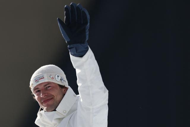 Bronze medallist Norway's Sturla Holm Laegreid gestures on the podium of the men's biathlon 20km individual event during the Milano Cortina 2026 Winter Olympic Games at the Anterselva Biathlon Arena (Sudtirol Arena) in Anterselva (Val Pusteria) on February 10, 2026. (Photo by FRANCK FIFE / AFP)