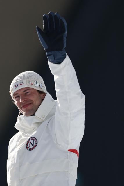 Bronze medallist Norway's Sturla Holm Laegreid gestures on the podium of the men's biathlon 20km individual event during the Milano Cortina 2026 Winter Olympic Games at the Anterselva Biathlon Arena (Sudtirol Arena) in Anterselva (Val Pusteria) on February 10, 2026. (Photo by FRANCK FIFE / AFP)
