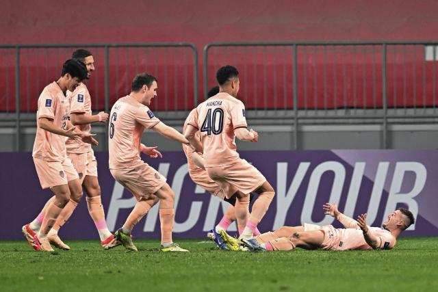 Buriram United's Brazilian Guilherme Bissoli (R) celebrates with teammates after scoring a goal during their AFC Champions League football match against Chengdu Rongcheng in Chengdu, southwestern China's Sichuan province on February 10, 2026. (Photo by -STR / CN-STR / AFP) / China OUT