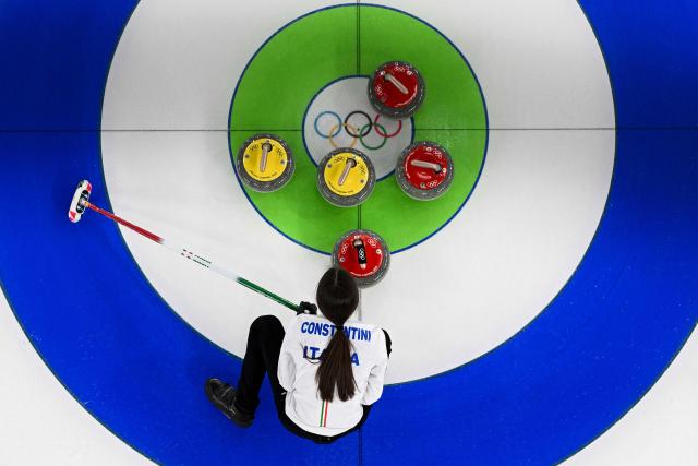 Italy's Stefania Constantini competes in the curling mixed doubles round robin bronze medal game between Great Britain and Italy during the Milano Cortina 2026 Winter Olympic Games at the Cortina Curling Olympic Stadium in Cortina d’Ampezzo on February 10, 2026. (Photo by Franзois-Xavier MARIT / AFP)