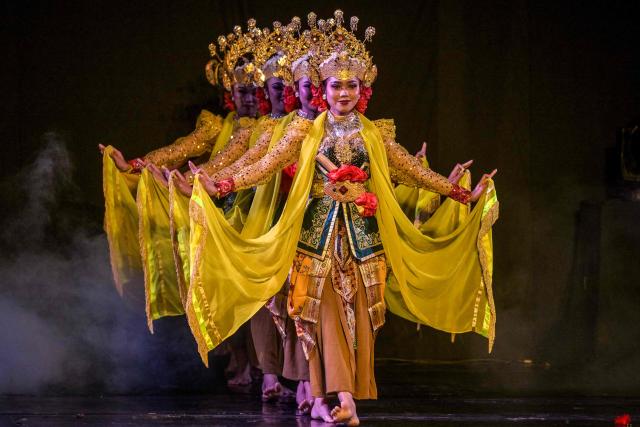 Artists perform a mask dance featuring the heroic Panji characters at Taman Budaya in Surabaya on February 10, 2026. (Photo by Juni KRISWANTO / AFP)