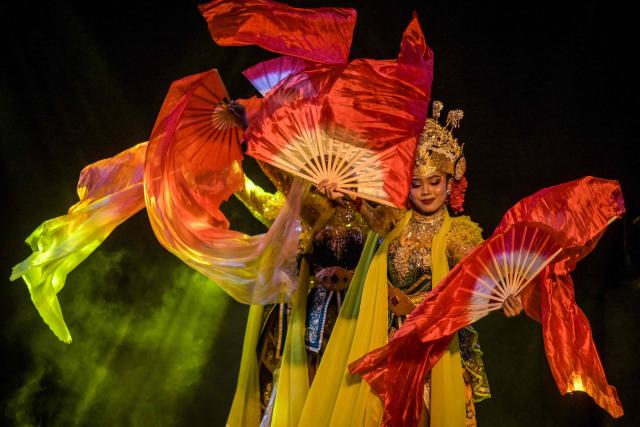 Artists perform a mask dance featuring the heroic Panji characters at Taman Budaya in Surabaya on February 10, 2026. (Photo by Juni KRISWANTO / AFP)