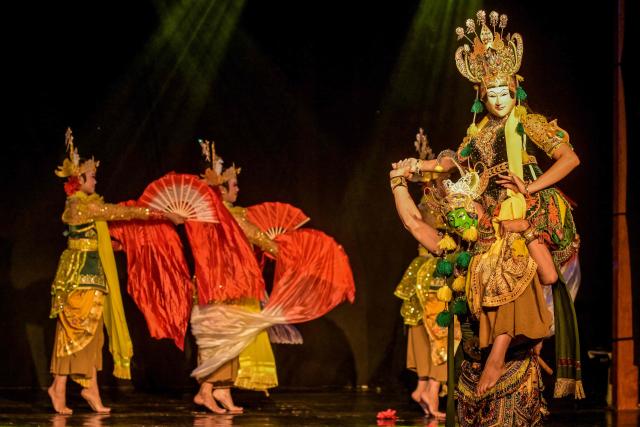 Artists perform a mask dance featuring the heroic Panji characters at Taman Budaya in Surabaya on February 10, 2026. (Photo by Juni KRISWANTO / AFP)