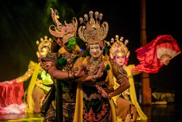 Artists perform a mask dance featuring the heroic Panji characters at Taman Budaya in Surabaya on February 10, 2026. (Photo by Juni KRISWANTO / AFP)
