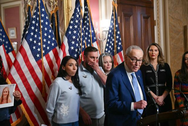 Sky Roberts (2L), brother of Virginia Giuffre, an accuser of Jeffrey Epstein, reacts as US Senator Chuck Schumer, Democrat from New York speaks during a news conference to introduce “Virginia’s Law” at the US Capitol in Washington, DC, on February 10, 2026. Named after Virginia Giuffre, the legislation aims to remove any statute of limitations for prosecuting sex traffickers. (Photo by Brendan SMIALOWSKI / AFP)