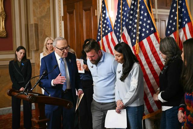 Sky Roberts (C), brother of Virginia Giuffre, an accuser of Jeffrey Epstein, listens as US Senator Chuck Schumer, Democrat from New York speaks during a news conference to introduce “Virginia’s Law” at the US Capitol in Washington, DC, on February 10, 2026. Named after Virginia Giuffre, the legislation aims to remove any statute of limitations for prosecuting sex traffickers. (Photo by Brendan SMIALOWSKI / AFP)
