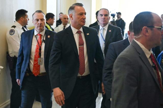 Todd Lyons (C), acting director of US Immigration and Customs Enforcement (ICE), arrives from a break to testify during a House Committee on Homeland Security hearing on Oversight of the Department of Homeland Security on Capitol Hill in Washington, DC, on February 10, 2026. (Photo by ANDREW CABALLERO-REYNOLDS / AFP)