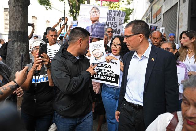 Relatives of political prisoners demonstrate in front of the national parliament building in Caracas on February 10, 2026. (Photo by Federico PARRA / AFP)