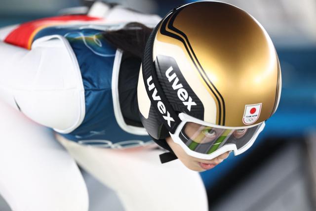 Japan's Nozomi Maruyama looks on before a jump during the ski jumping mixed team trial round of the Milano Cortina 2026 Winter Olympic Games at Predazzo Ski Jumping Stadium in Predazzo (Val di Fiemme), on February 10, 2026. (Photo by Anne-Christine POUJOULAT / AFP)