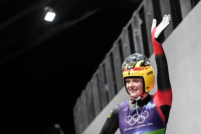 Germany's Anna Berreiter reacts after crossing the finish line in the luge women's singles run 4 at Cortina Sliding Centre during the Milano Cortina 2026 Winter Olympic Games in Cortina d'Ampezzo on February 10, 2026. (Photo by Tiziana FABI / AFP)