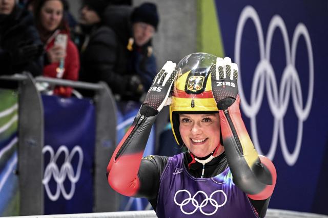 Germany's Anna Berreiter reacts after crossing the finish line in the luge women's singles run 4 at Cortina Sliding Centre during the Milano Cortina 2026 Winter Olympic Games in Cortina d'Ampezzo on February 10, 2026. (Photo by Tiziana FABI / AFP)