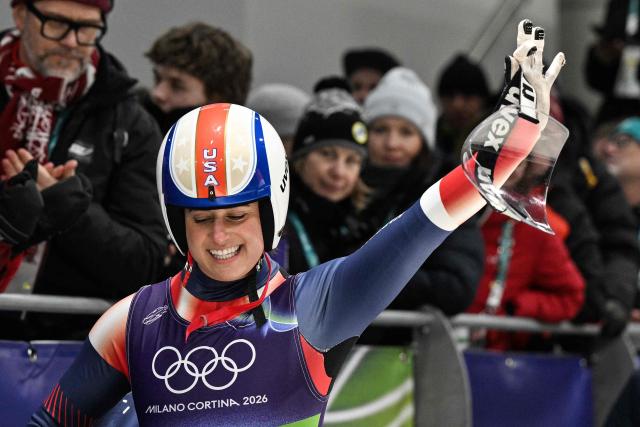 USA's Emily Fischnaller reacts after crossing the finish line in the luge women's singles run 4 at Cortina Sliding Centre during the Milano Cortina 2026 Winter Olympic Games in Cortina d'Ampezzo on February 10, 2026. (Photo by Tiziana FABI / AFP)