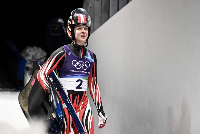Austria's Lisa Schulte reacts after crossing the finish line in the luge women's singles run 4 at Cortina Sliding Centre during the Milano Cortina 2026 Winter Olympic Games in Cortina d'Ampezzo on February 10, 2026. (Photo by Tiziana FABI / AFP)