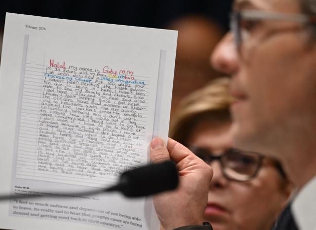US Representative James Walkinshaw, Democrat from Virginia holds up a letter from a 14 year old detained in an federal facility during a House Committee on Homeland Security hearing on Oversight of the Department of Homeland Security on Capitol Hill in Washington, DC, on February 10, 2026. The heads of US agencies responsible for immigration testified before Congress Tuesday after two fatal shootings by federal officers in Minneapolis sparked mounting pressure against President Donald Trump's mass crackdown. (Photo by ANDREW CABALLERO-REYNOLDS / AFP)