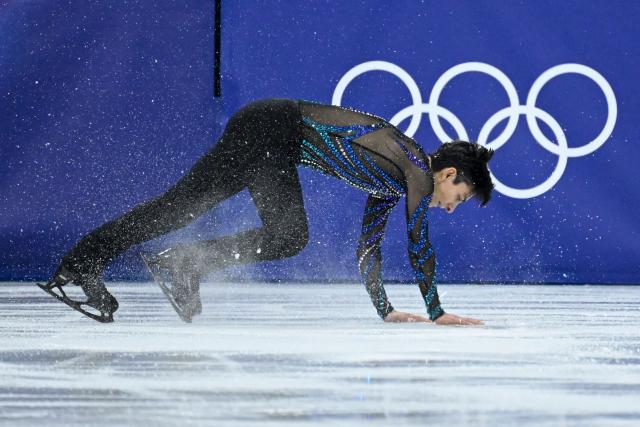 Mexico's Donovan Carrillo falls as he competes in the figure skating men's singles short program during the Milano Cortina 2026 Winter Olympic Games at Milano Ice Skating Arena in Milan on February 10, 2026. (Photo by WANG Zhao / AFP)