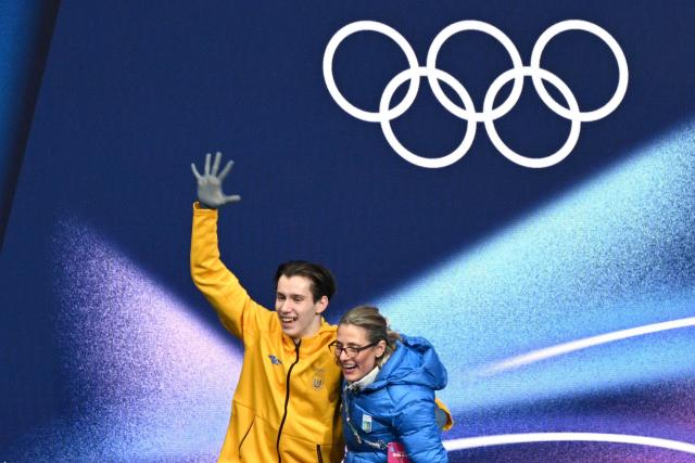 Ukraine's Kyrylo Marsak reacts at the kiss and cry area after competing in the figure skating men's singles short program during the Milano Cortina 2026 Winter Olympic Games at Milano Ice Skating Arena in Milan on February 10, 2026. (Photo by Antonin THUILLIER / AFP)