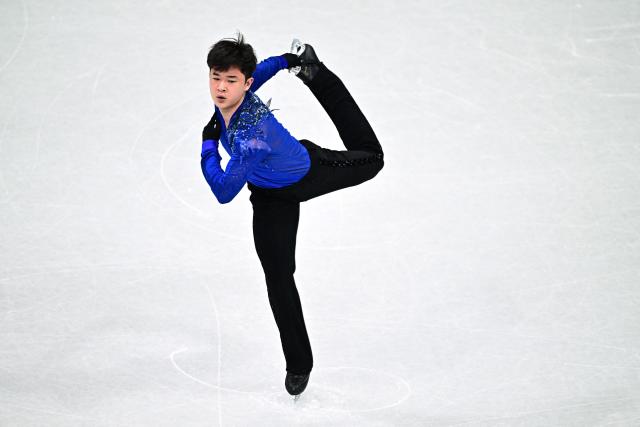 South Korea's Kim Hyungyeom competes in the figure skating men's singles short program during the Milano Cortina 2026 Winter Olympic Games at Milano Ice Skating Arena in Milan on February 10, 2026. (Photo by JULIEN DE ROSA / AFP)