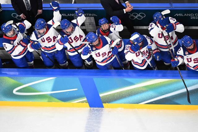 USA's players celebrate a team goal  during the women's preliminary round Group A Ice Hockey match between Canada and USA at the Milano Santagiulia Ice Hockey Arena during the Milano Cortina 2026 Winter Olympic Games in Milan, on February 10, 2026. (Photo by Wikus de WET / AFP)