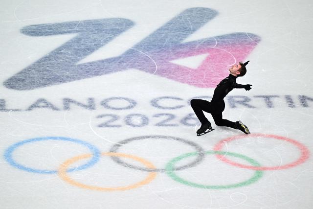 Italy's Matteo Rizzo competes in the figure skating men's singles short program during the Milano Cortina 2026 Winter Olympic Games at Milano Ice Skating Arena in Milan on February 10, 2026. (Photo by JULIEN DE ROSA / AFP)