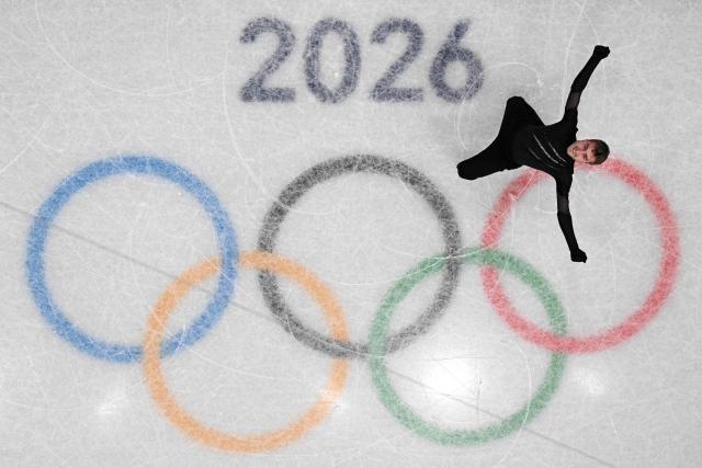 Italy's Matteo Rizzo competes in the figure skating men's singles short program during the Milano Cortina 2026 Winter Olympic Games at Milano Ice Skating Arena in Milan on February 10, 2026. (Photo by Antonin THUILLIER / AFP)