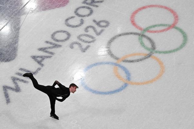 Italy's Matteo Rizzo competes in the figure skating men's singles short program during the Milano Cortina 2026 Winter Olympic Games at Milano Ice Skating Arena in Milan on February 10, 2026. (Photo by Antonin THUILLIER / AFP)