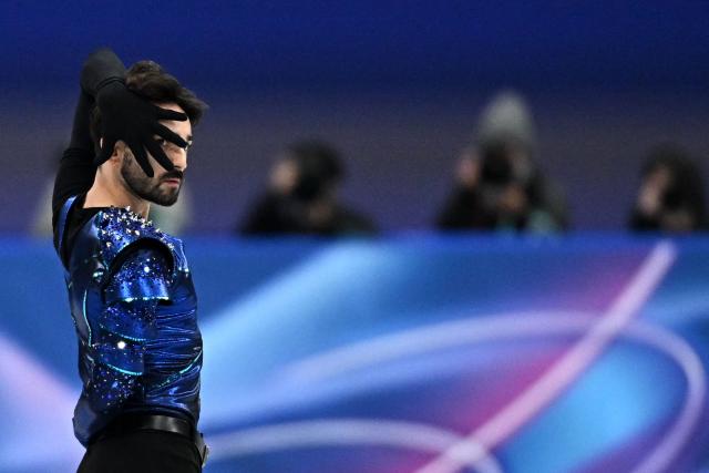 France's Kevin Aymoz competes in the figure skating men's singles short program during the Milano Cortina 2026 Winter Olympic Games at Milano Ice Skating Arena in Milan on February 10, 2026. (Photo by Gabriel BOUYS / AFP)