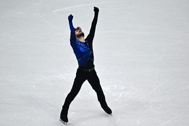 France's Kevin Aymoz competes in the figure skating men's singles short program during the Milano Cortina 2026 Winter Olympic Games at Milano Ice Skating Arena in Milan on February 10, 2026. (Photo by JULIEN DE ROSA / AFP)