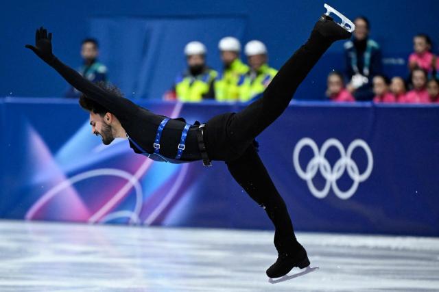 France's Kevin Aymoz competes in the figure skating men's singles short program during the Milano Cortina 2026 Winter Olympic Games at Milano Ice Skating Arena in Milan on February 10, 2026. (Photo by WANG Zhao / AFP)