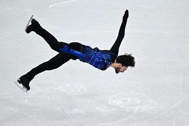 France's Kevin Aymoz competes in the figure skating men's singles short program during the Milano Cortina 2026 Winter Olympic Games at Milano Ice Skating Arena in Milan on February 10, 2026. (Photo by JULIEN DE ROSA / AFP)